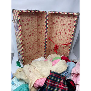 Vintage 1950s doll clothes in suitcase closet